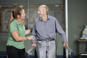 Mercy Care Centre Young Allied Health Assistant Samantha with patient Greg 